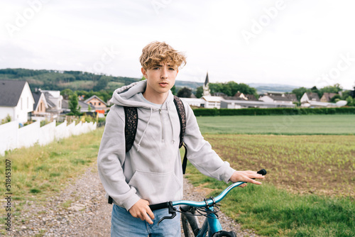 Teenager with a bike outdoor photo