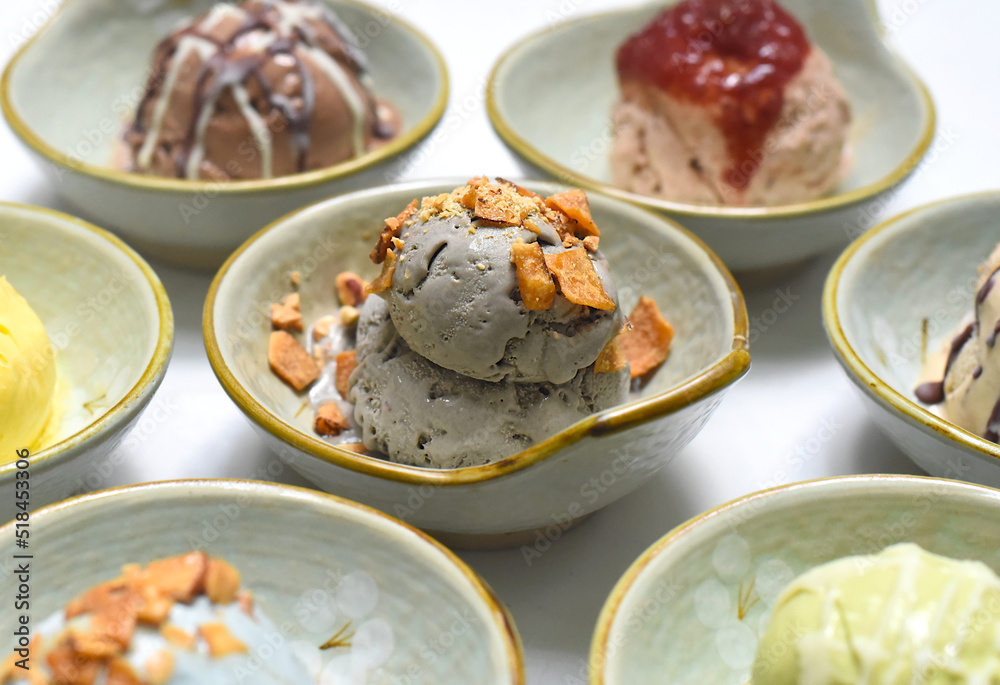 Organic ice cream in ceramic bowls on white background closeup