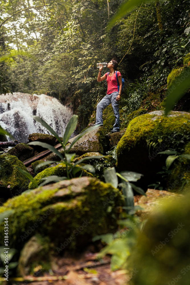 woman drinking water outdoors woman drinking water outdoors