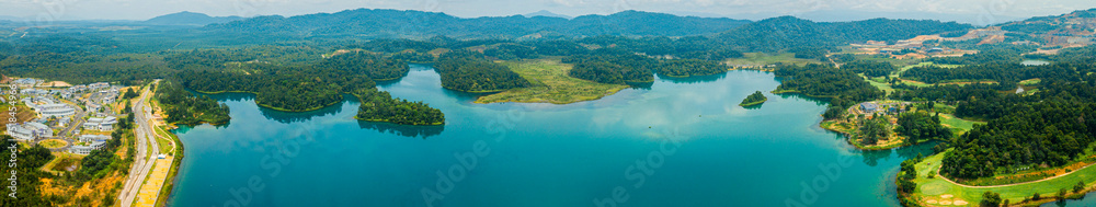 Aerial drone view of lake scenery with turquoise water in Tasik Puteri, Bukit Besi, Terengganu, Malaysia.