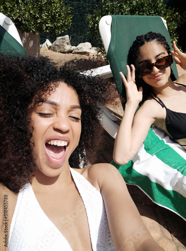 Self-portrait of young friends sunbathing 