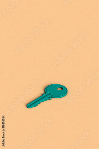 a blue key on a pink background