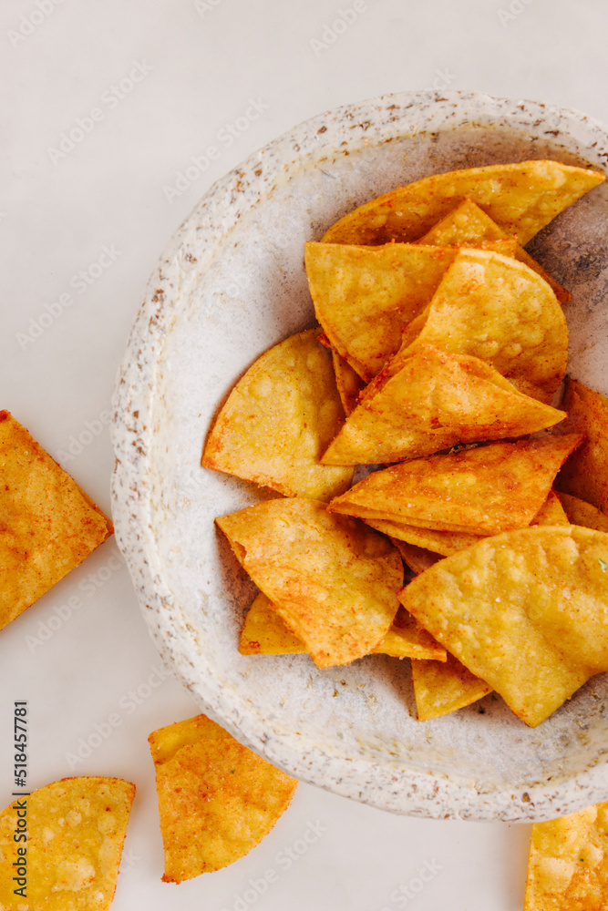 Delicious nachos on plate on table Delicious nachos on plate on table