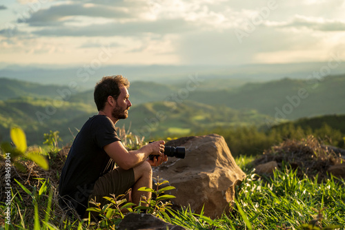 tourist with camera in a landscape