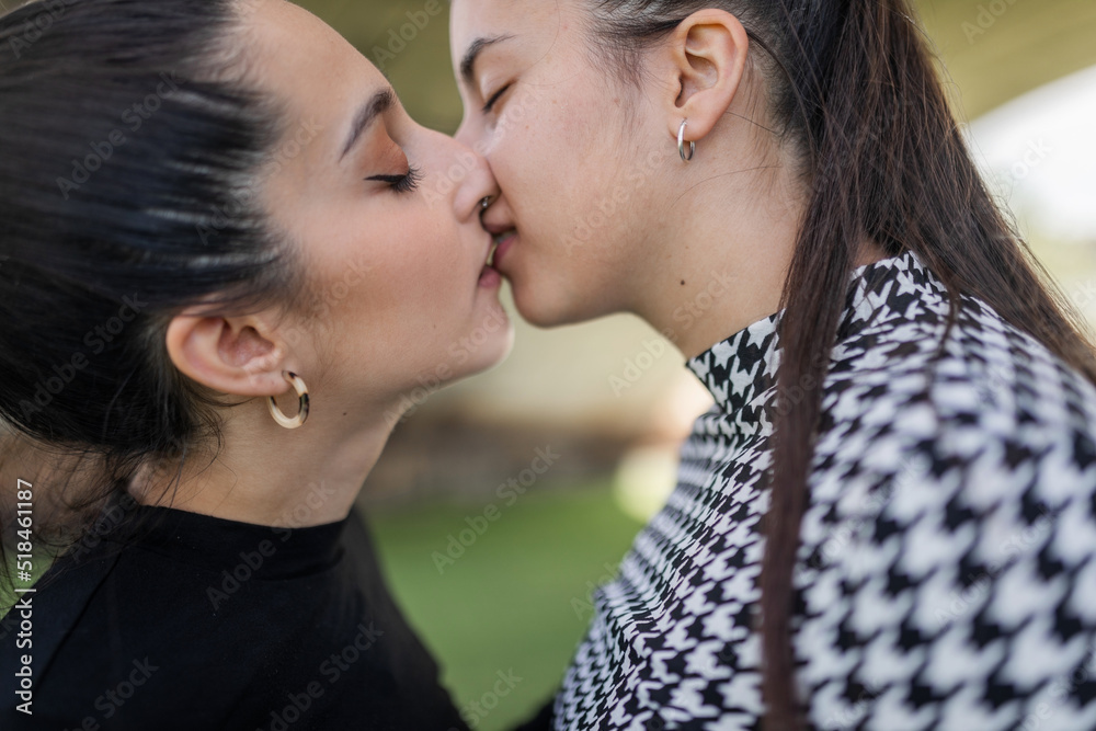 young lesbian couple together in a city park