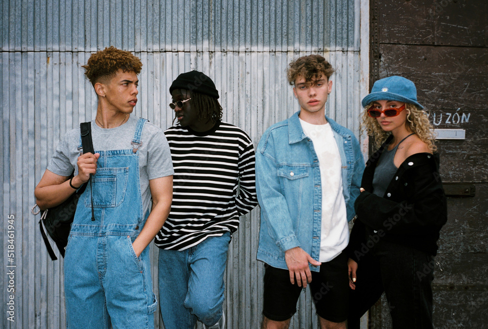 © BONNINSTUDIO/Stocksy - Diverse trendy youngsters on the street