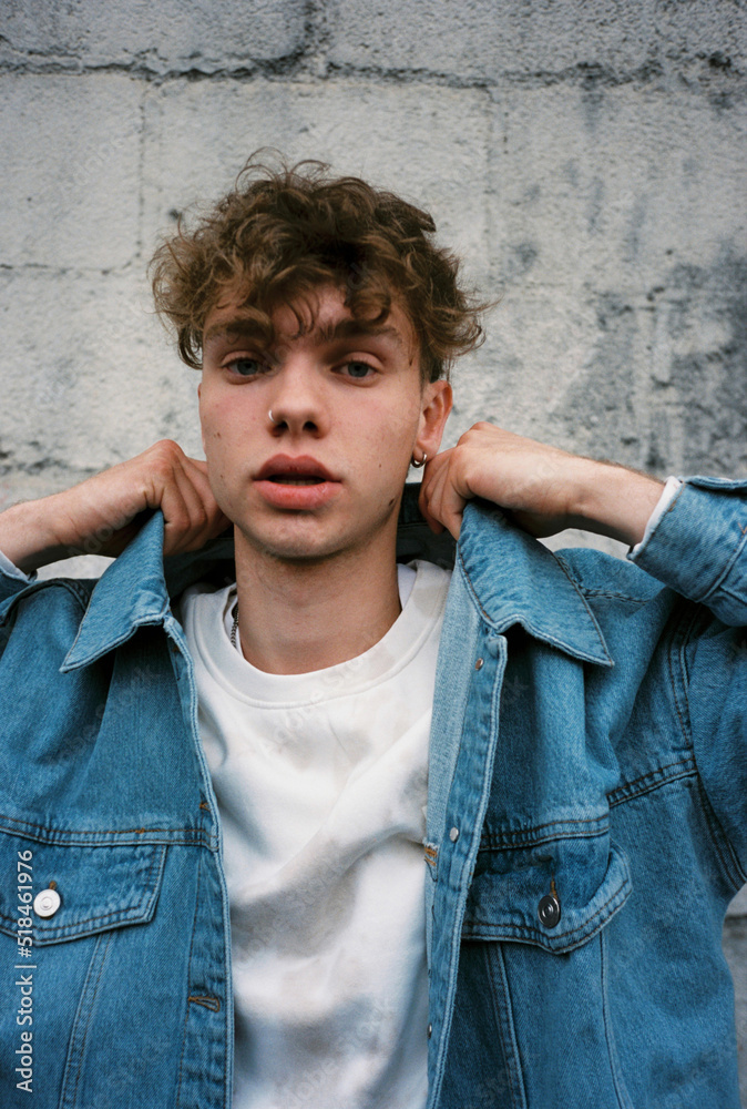 © BONNINSTUDIO/Stocksy - Stylish teenage boy on the street