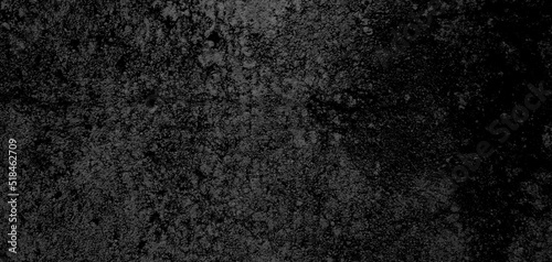 Dark black textured concrete stone wall abstract background.