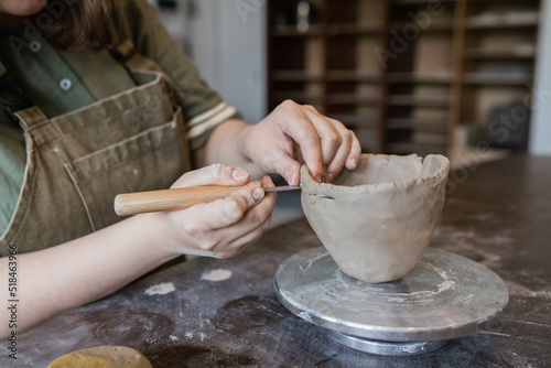 The process of modeling and creating a custom ceramic cup in workshop  photo