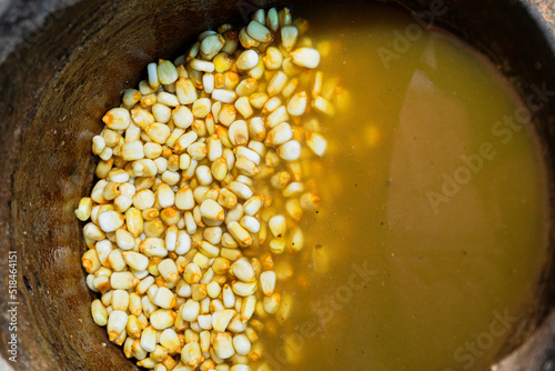 Yellow corn kernels in a bow with water photo