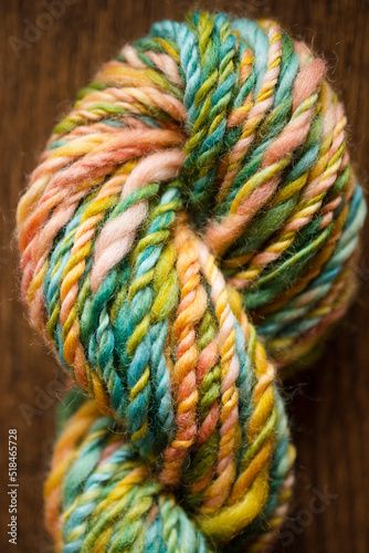 Close up of hand dyed and hand spun rainbow wool yarn photo