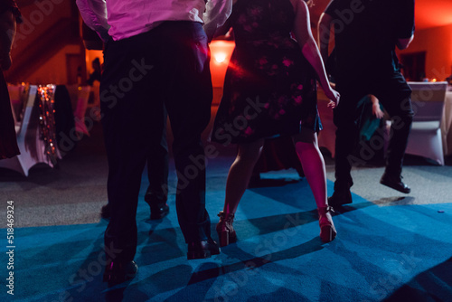 anonymous group of feet dancing at a party photo