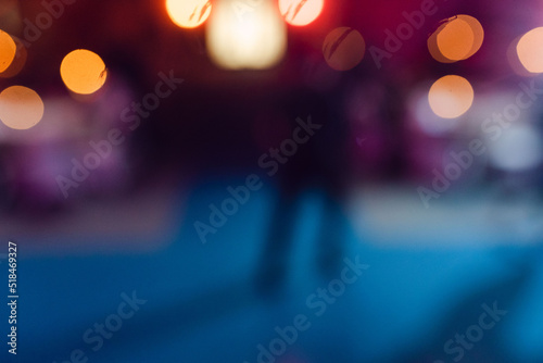 out of focus photo of someone  dancing at a party photo