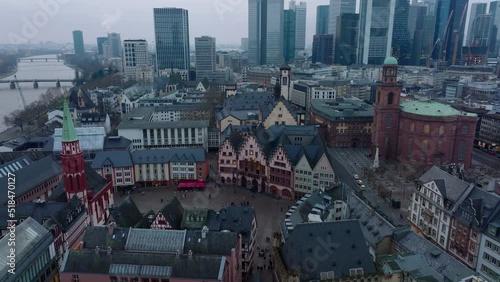 Historic buildings at medieval old town square. Aerial view of Roemerberg and modern skyscrapers in background. Frankfurt am Main, Germany photo