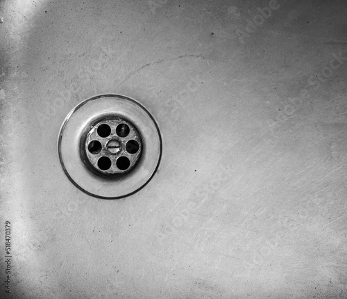 Old dirty metal sink background texture. Old iron kitchen sink.Black and white sink with drain.