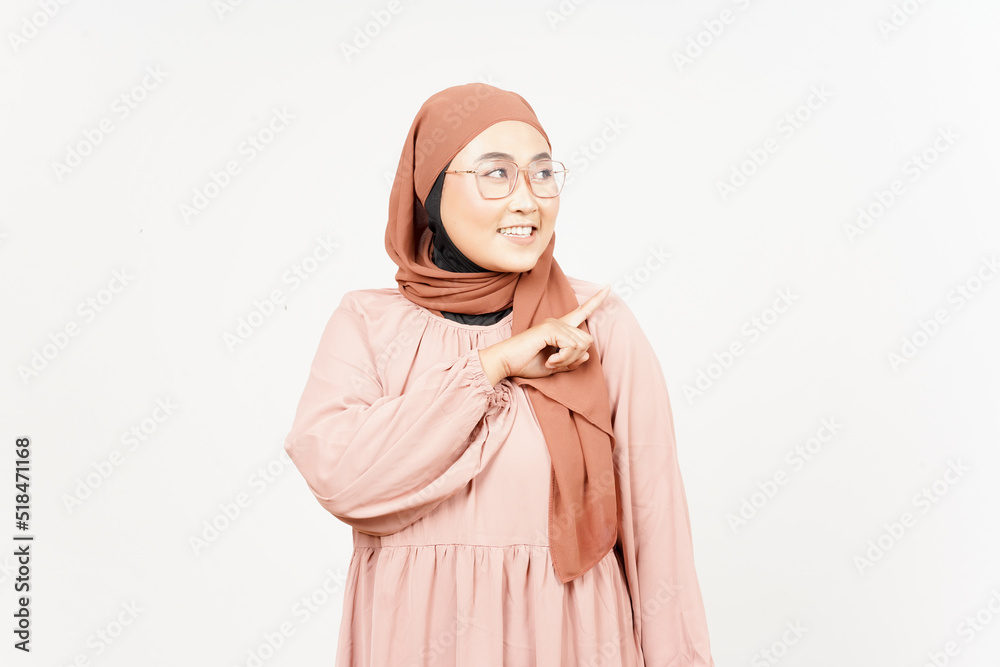 Showing Product and Pointing Side of Beautiful Asian Woman Wearing Hijab Isolated On White Showing Product and Pointing Side of Beautiful Asian Woman Wearing Hijab Isolated On White