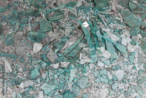 Broken glass shards on the floor.