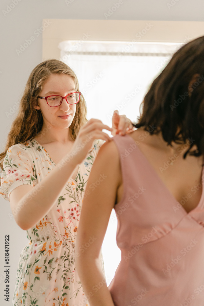 young seamstress pinning a dress young seamstress pinning a dress