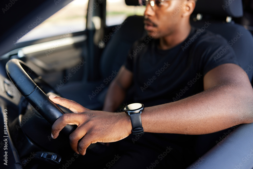 Crop black male driver during trip Crop black male driver during trip