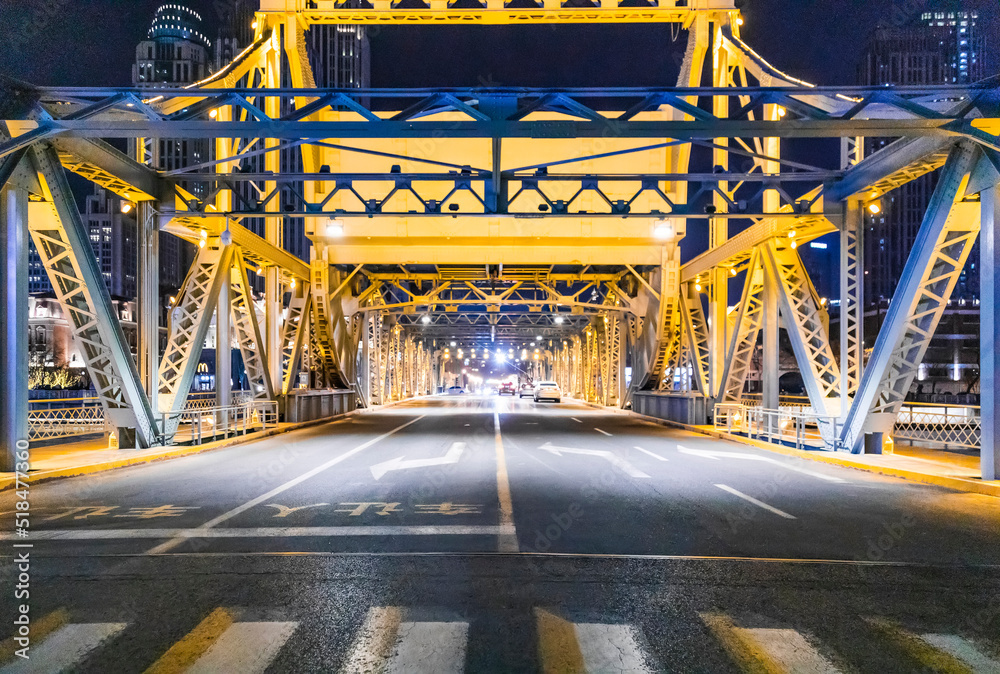 Bridge over river at night in Tianjin city