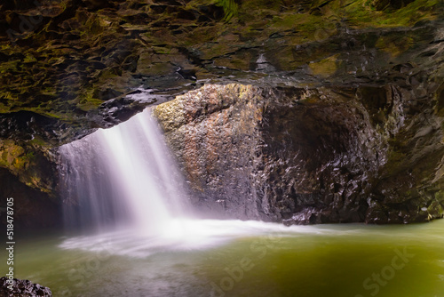 Natural Bridge in Springbrook National Park with waterfall. 