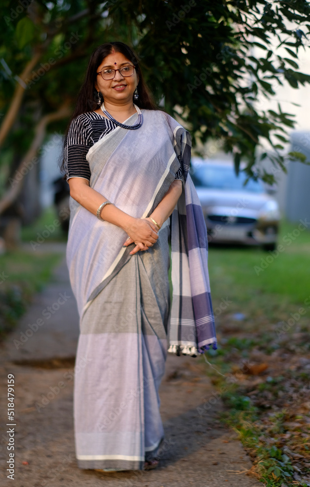 Indian woman wearing fashionable sari at outdoors in daytime Indian woman wearing fashionable sari at outdoors in daytime