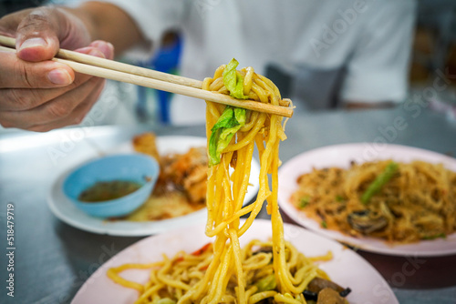 Soba noodles on chopsticks photo
