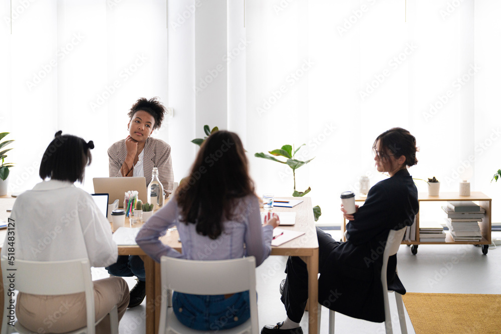 Diverse designers taking break during meeting Diverse designers taking break during meeting