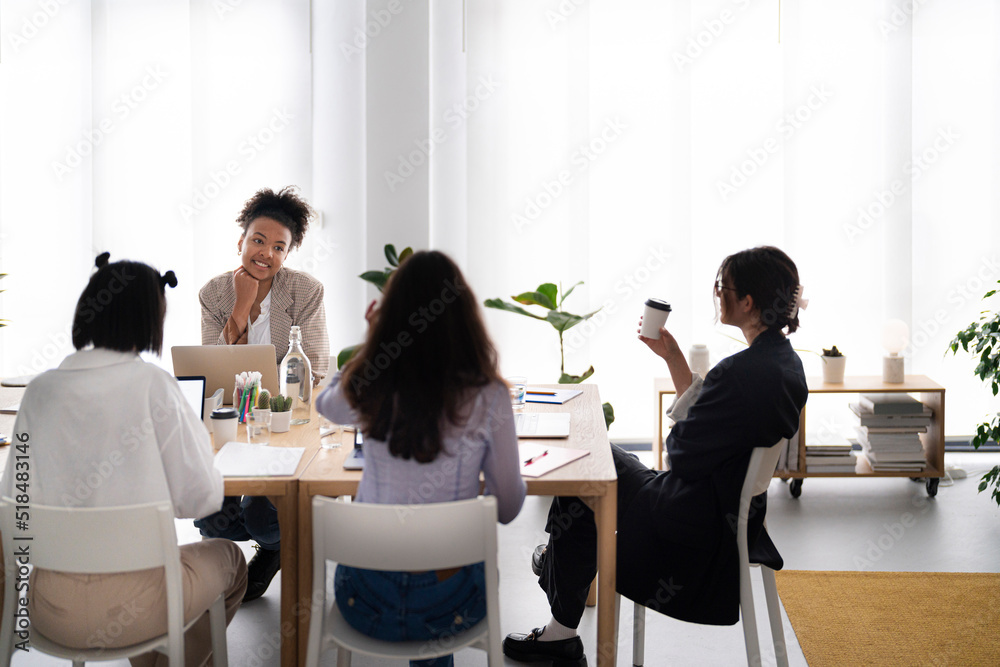 Diverse designers taking break during meeting Diverse designers taking break during meeting