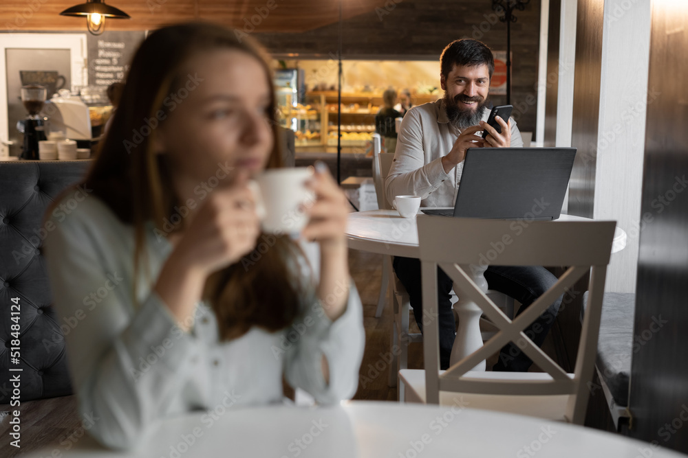 curious guy loves beautiful girl looking with interest at lady sitting nearby in cafe, flirting in public place, dating and love at first sight curious guy loves beautiful girl looking with interest at lady sitting nearby in cafe, flirting in public place, dating and love at first sight