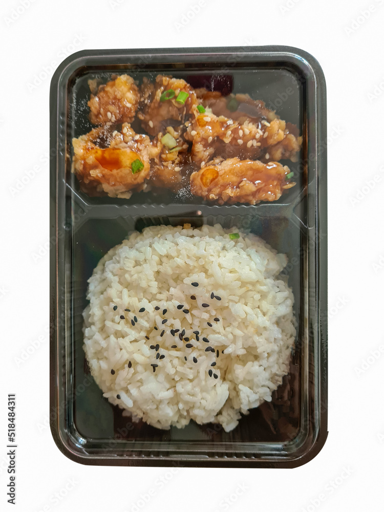 top view of korean fried chicken with steamed rice in a box On a isolated white background. Asian food. Food delivery. top view of korean fried chicken with steamed rice in a box On a isolated white background. Asian food. Food delivery.