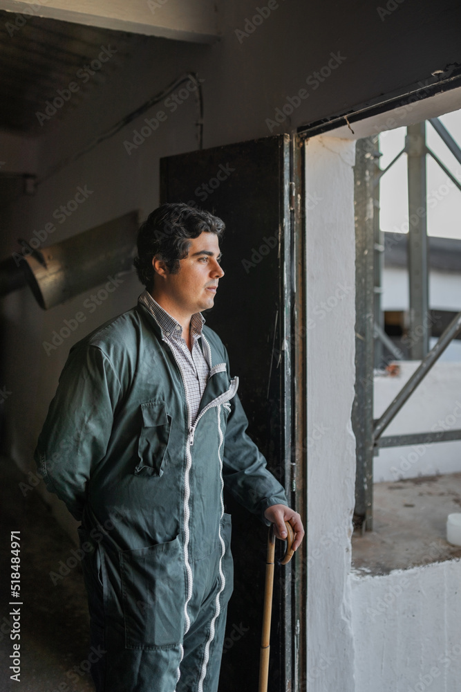 portrait of young rancher inside his ranch