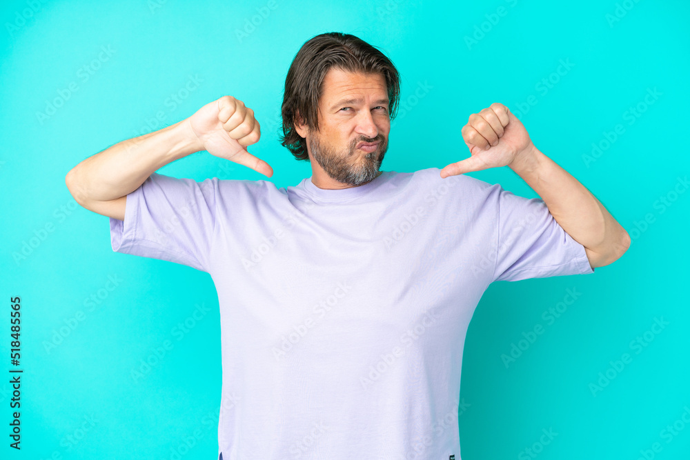 Senior dutch man isolated on blue background proud and self-satisfied Senior dutch man isolated on blue background proud and self-satisfied