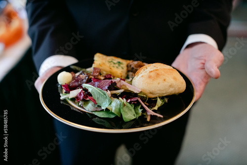 Man Holding Plate of Buffet Food at Wedding photo