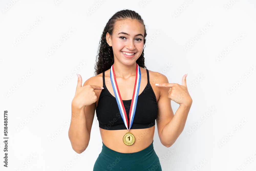 Young sport woman with medals isolated on white background with surprise facial expression Young sport woman with medals isolated on white background with surprise facial expression