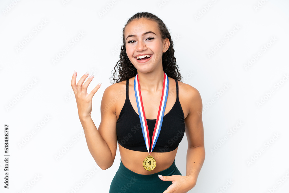 Young sport woman with medals isolated on white background making guitar gesture Young sport woman with medals isolated on white background making guitar gesture