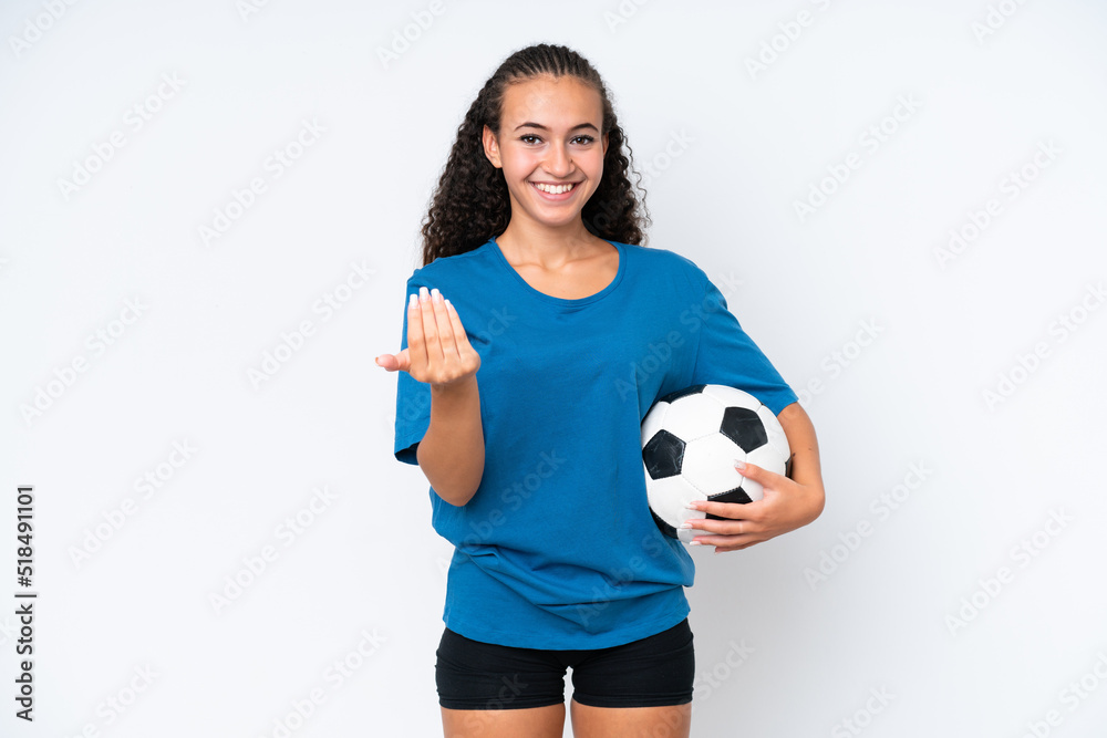 Young woman isolated on white background with soccer ball and doing coming gesture Young woman isolated on white background with soccer ball and doing coming gesture