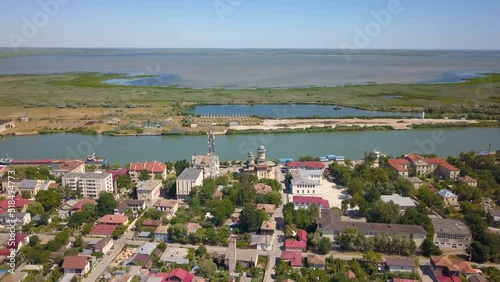 Aerial view of Sulina city harbor and the Danube flowing into the Black Sea photo