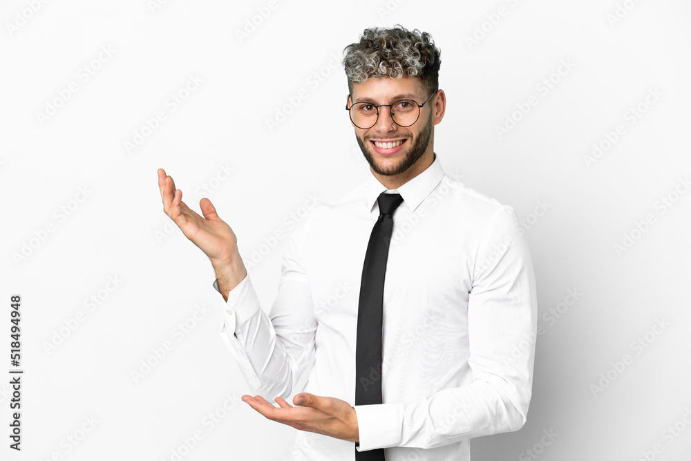 Business caucasian man isolated on white background extending hands to the side for inviting to come Business caucasian man isolated on white background extending hands to the side for inviting to come