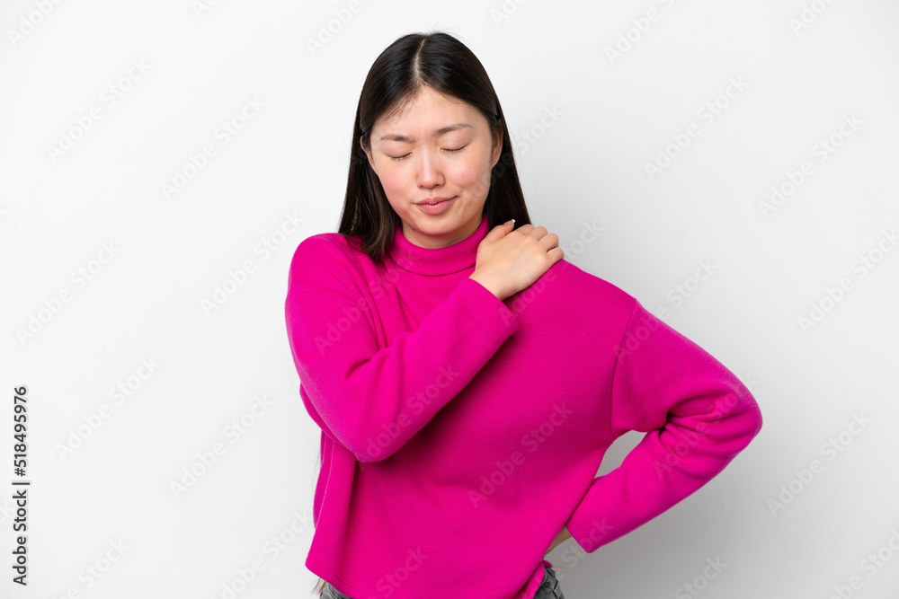 Young Chinese woman isolated on white background suffering from pain in shoulder for having made an effort Young Chinese woman isolated on white background suffering from pain in shoulder for having made an effort