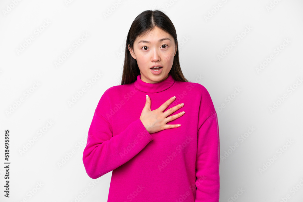 Young Chinese woman isolated on white background surprised and shocked while looking right Young Chinese woman isolated on white background surprised and shocked while looking right