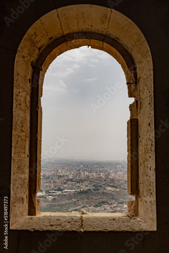 Panoramic view of Oran city from Santa Cruz fortress, one of the three forts in Oran, the second largest port of Algeria; Summer day, looking from high above towards the city. photo