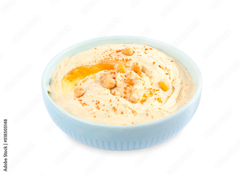 Tasty hummus with garnish in bowl isolated on white