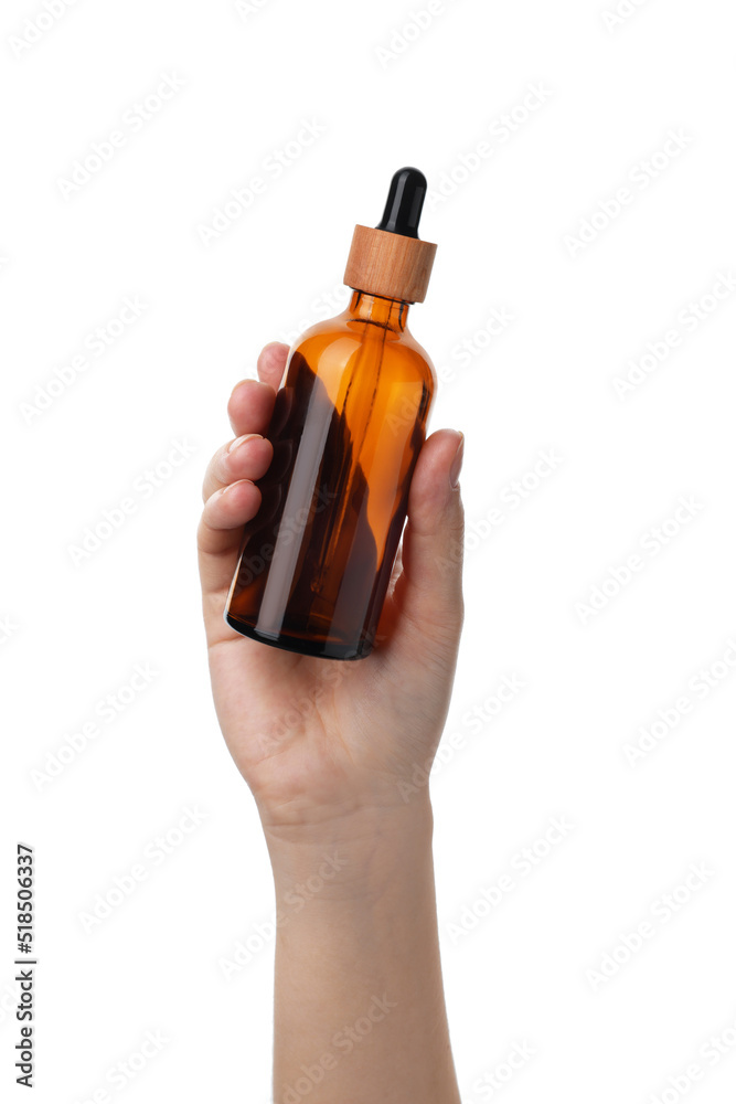 Woman holding glass bottle with dropper isolated on white, closeup
