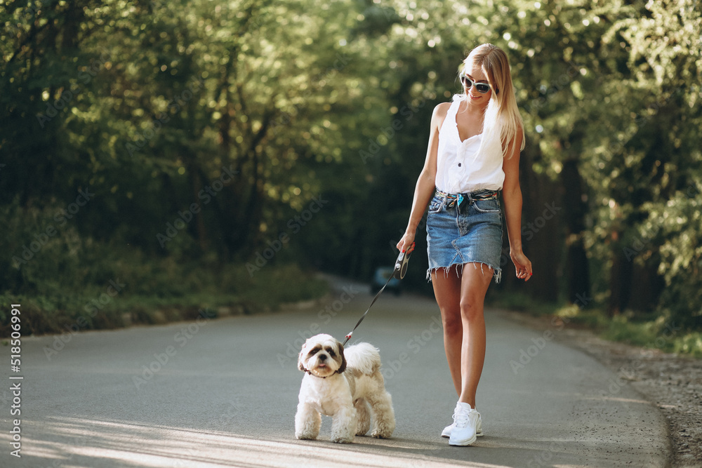 Pretty woman with her dog out in the park Pretty woman with her dog out in the park