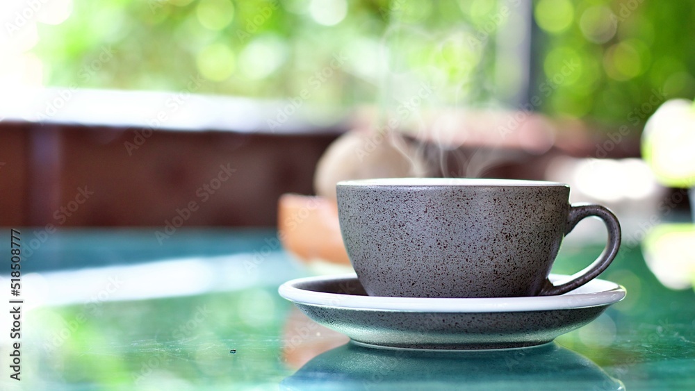 Hot coffee on table with blur background. Hot coffee on table with blur background.