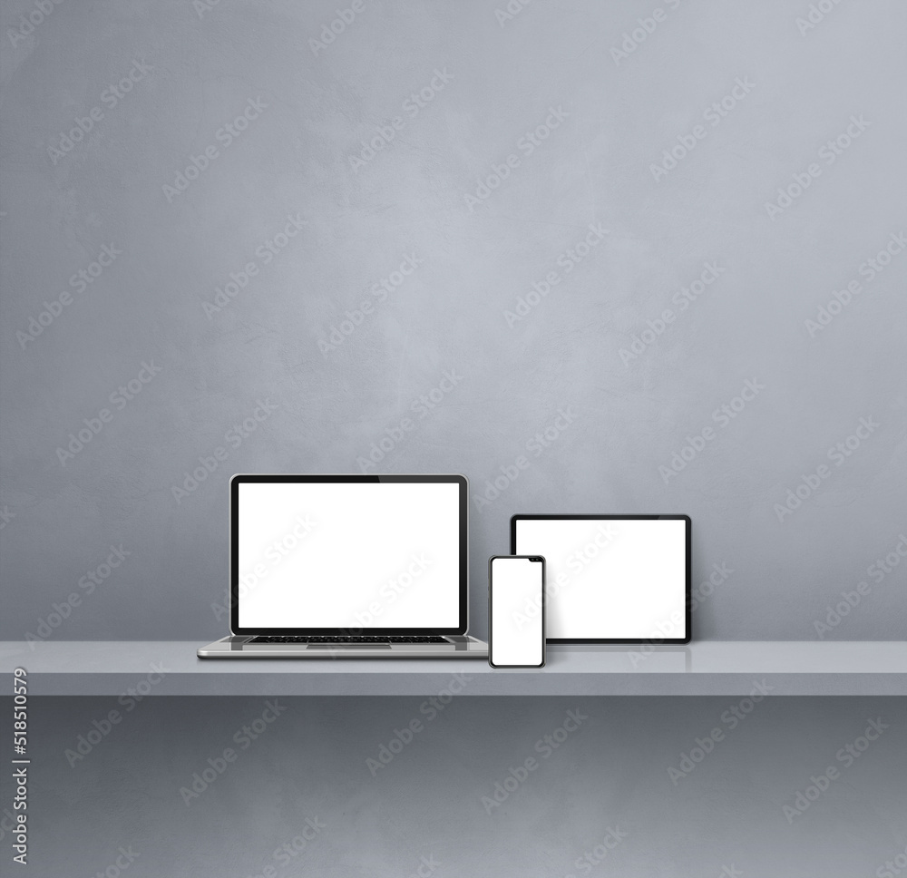 Laptop, mobile phone and digital tablet pc on grey wall shelf. Square background Laptop, mobile phone and digital tablet pc on grey wall shelf. Square background