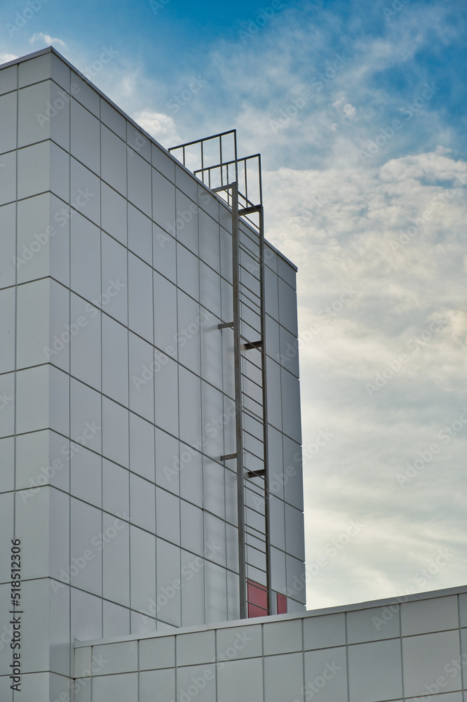 Fire escape ladder to the roof of modern building made of metal structures