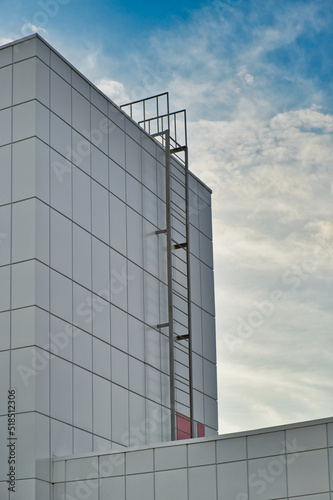 Fire escape ladder to the roof of modern building made of metal structures