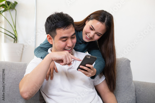 Happy young Asian couple after marriage. Their faces were filled with love.